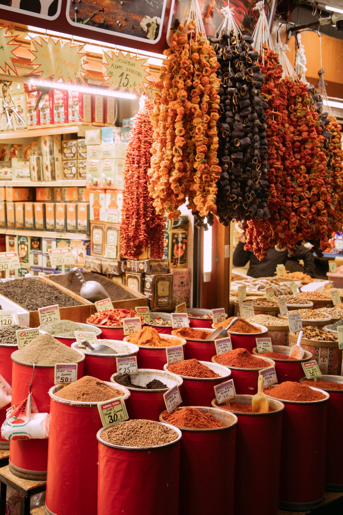 Overhead view of cooks and customers around a colorful street food stall